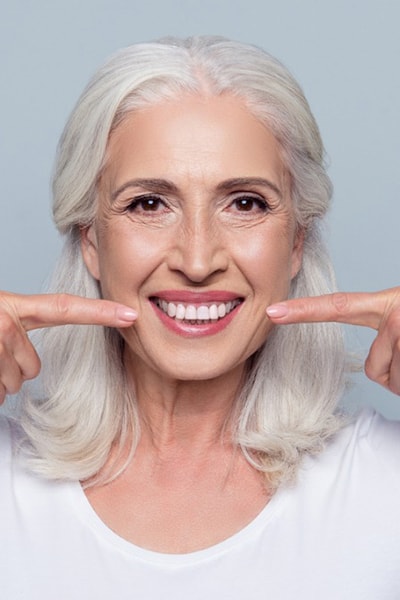 Russian mid age woman with dental implants