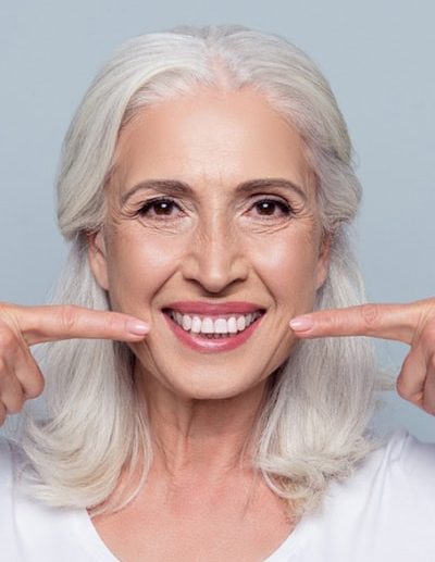 mid-age woman with best straight teeth