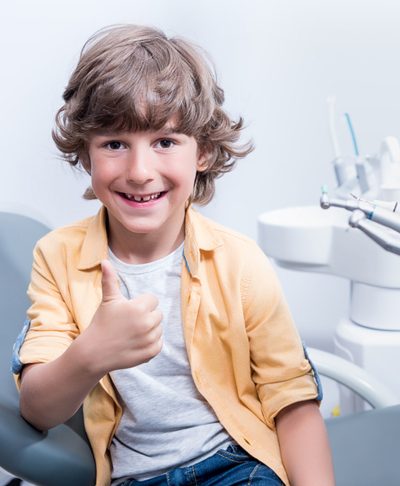 children dentistry kid with smile and thumbs up